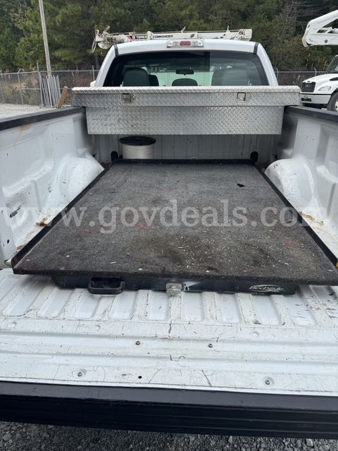 Pickup truck slide out tray