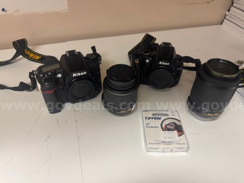 2 Nikon Cameras with 2 Lens