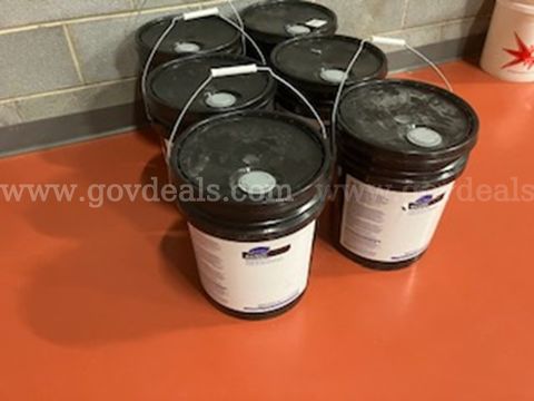 one lot of six 5-gallon black floor wax (AGO-HYCA)