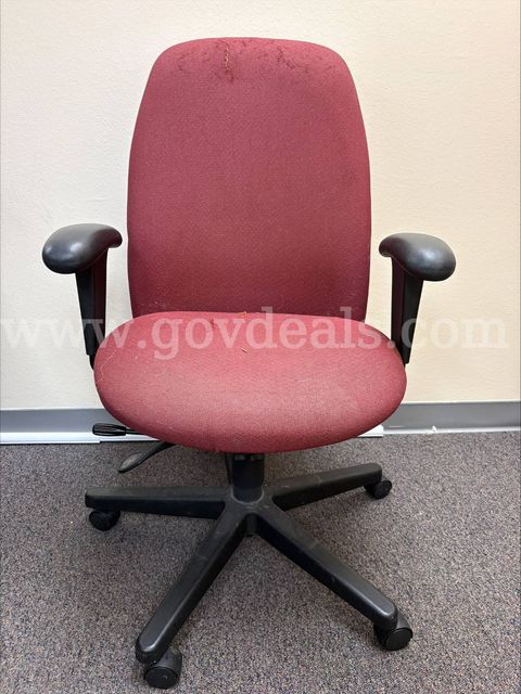 Red fabric rolling chair with black armrests