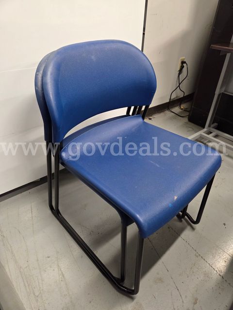 Set of 2 stacking blue plastic chairs with metal legs