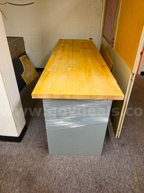 Desk with a wood top and metal frame. 8ft x 30 in. x 3ft