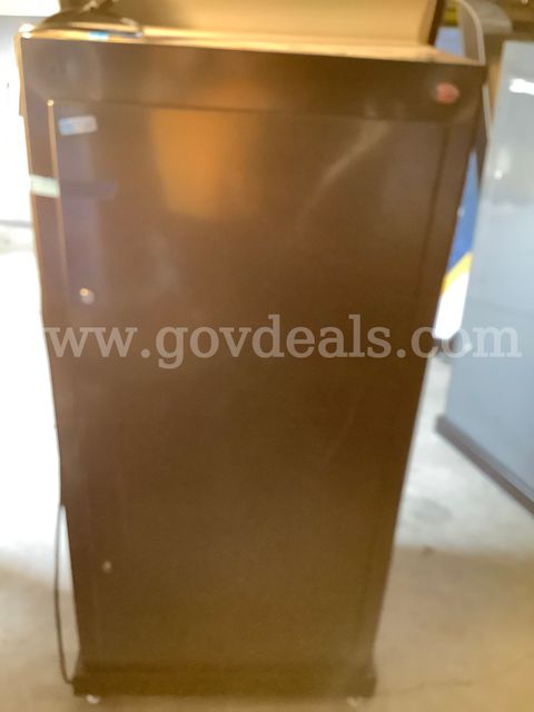 Holds 12 laptops, machine is 30x29x60