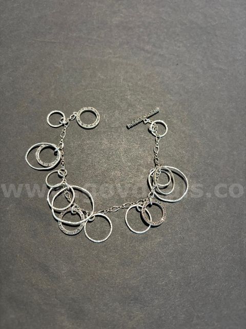 TiDDRs: Beautiful 7" Toggle Bracelet. Looks like silver. No Magnetism. No stamp.