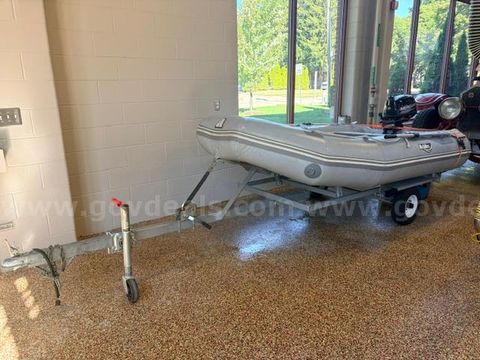 10 foot inflatable boat with 6hp outboard motor and trailer