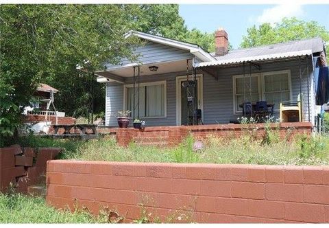 Charming residential home alongside a commercial building.