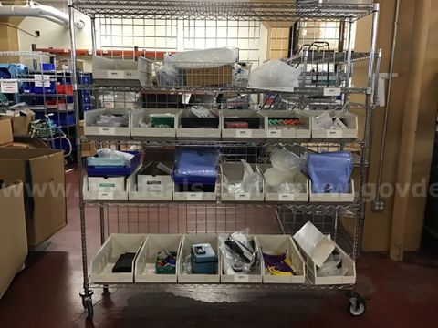 Metal Rack on Wheels containing Medical Supplies