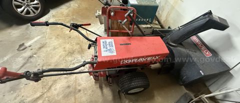 One Gravely Tractor with One Gravely Snow Blower Attachment