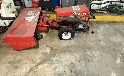 One Gravely Tractor with One Gravely Power Brush/Sweeper Attachment