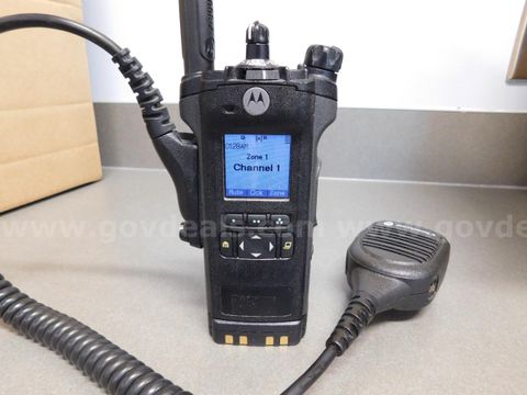 12 Motorola APX 6000 radios w/ charger, battery, mic, long antenna, carry holder each.