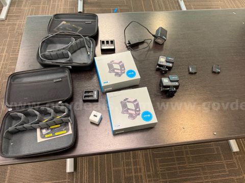 Lot of 2 GoPro HERO6 Black Action Cameras with Frames, Extra Batteries, Chargers, and Cases (Sold As-Is)