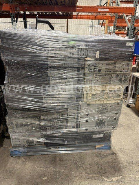 pallet of Desktop’s In Various States of Disrepair with and without Hard drives