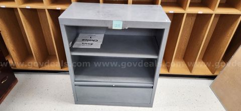 Metal bookshelf with drawer