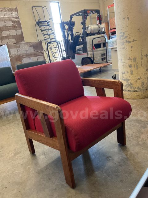 Red chair with wooden arm rest