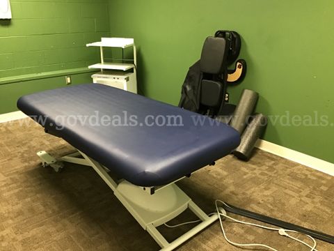 1 Electric massage bed, a warmer with stand, and a portable massage chair