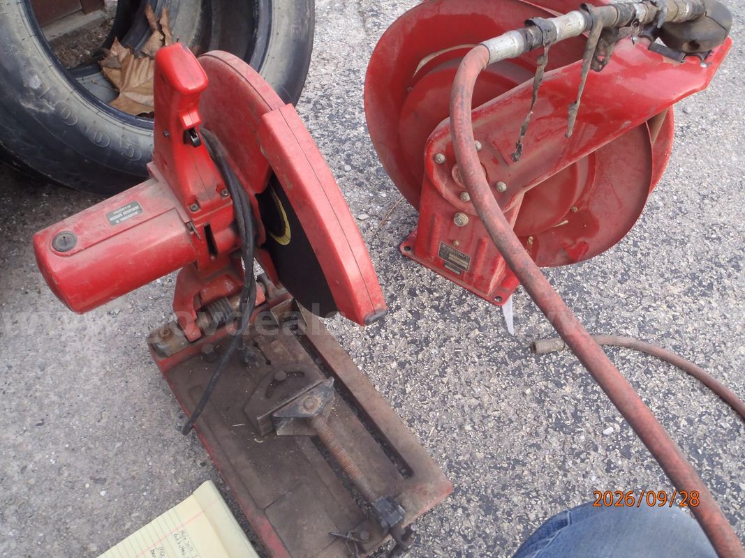 Milwaukee chop saw and 50-foot air hose on a reel
