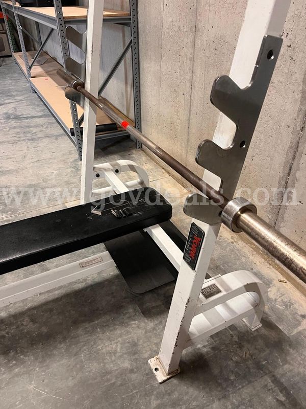 Weightlifting flat bench with bar