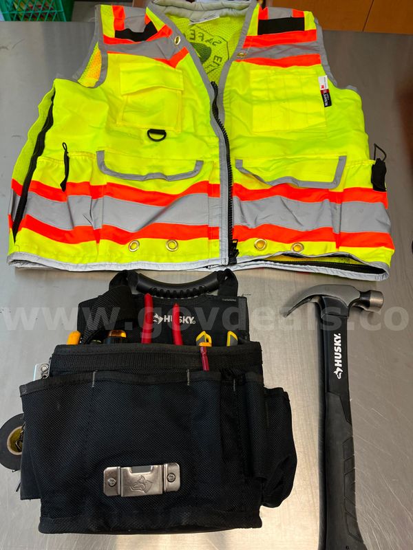 Husky tool belt with various tools and neon safety vest