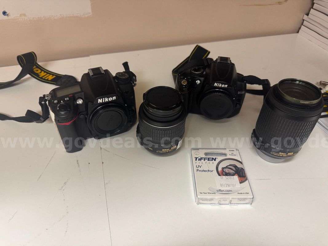2 Nikon Cameras with 2 Lens