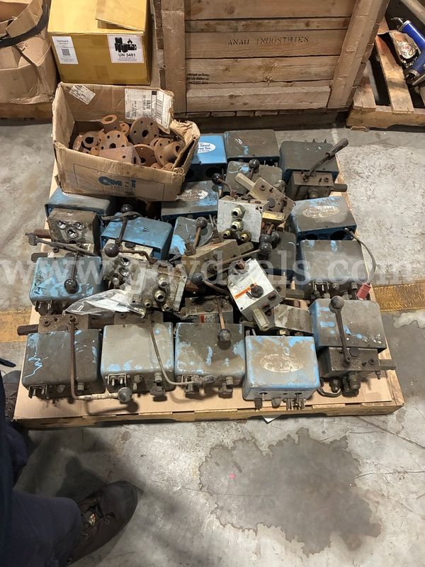 Pallet of sander control valves and assorted PTO hub flanges