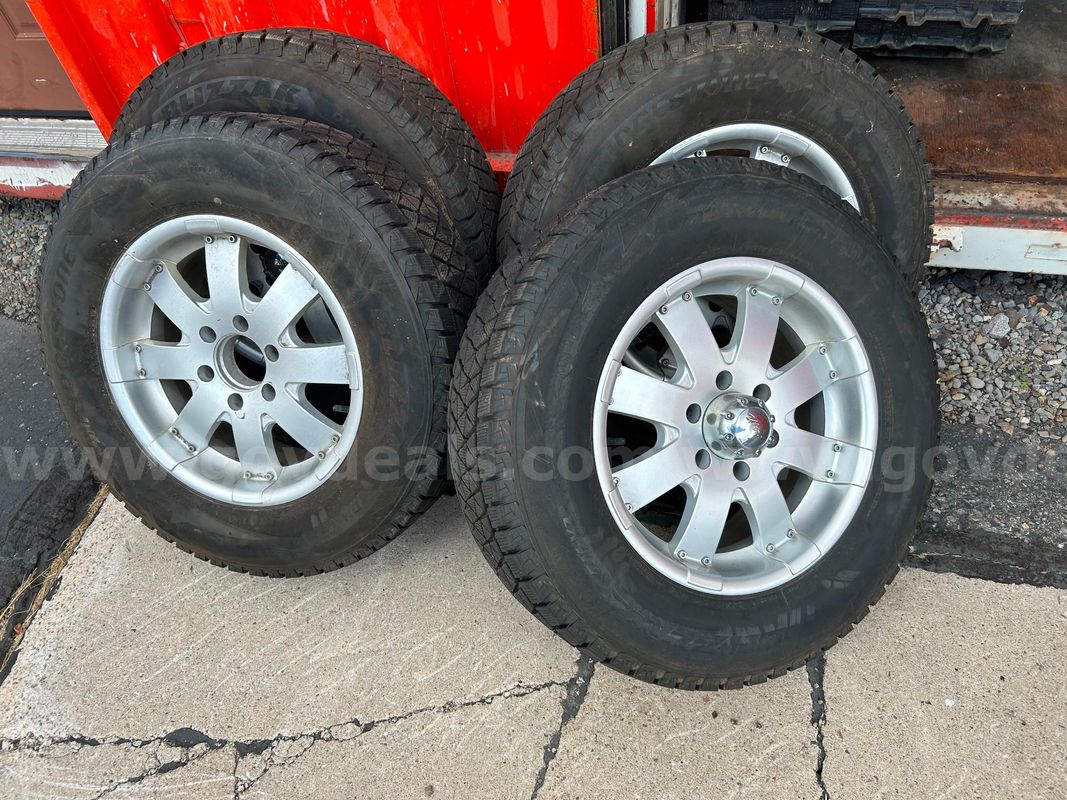 Bridgestone Blizzak DM-V2 Tires 245/70 R17 with Chrome 8-Star Rims (Set of 4)