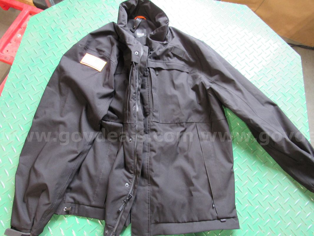 Several Bags of Black Uniform Jackets & Pants