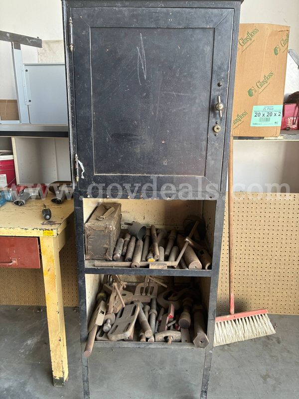 Various metal lathe tooling and storage cabinet.