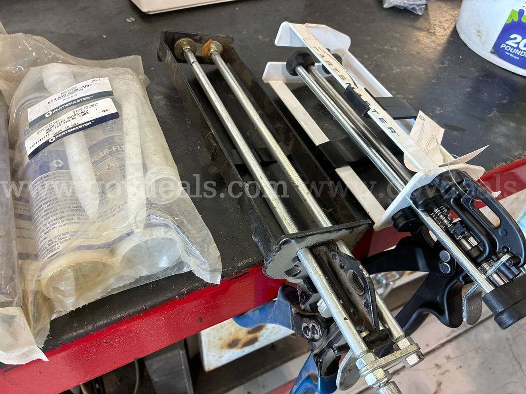 Two-part epoxy caulking guns and several tubes of two-part epoxy.