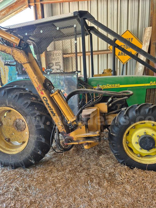 John Deere 5420 Tractor with Cheetah Boom Mower Attachment