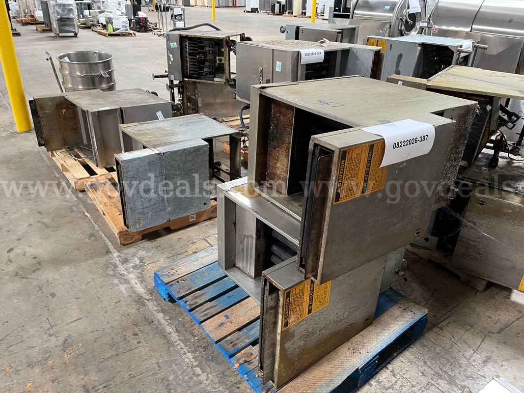 Lot of deep fryers and mixer bowl