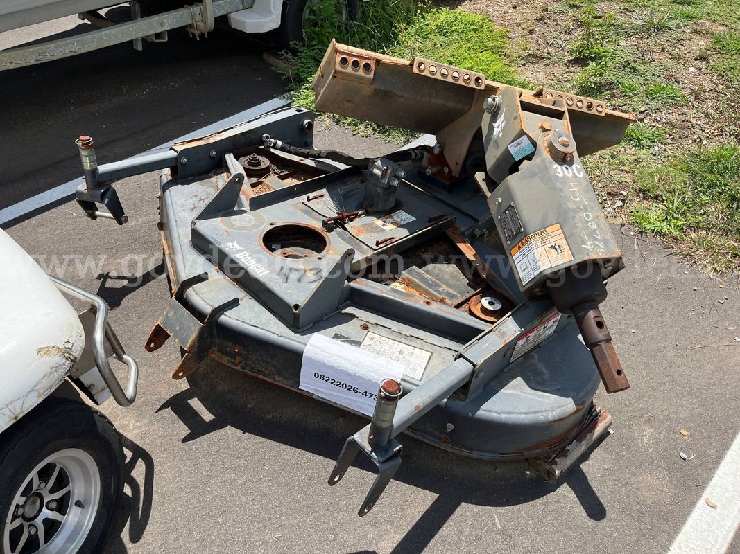 Lot of a Mower Cutting Deck and a PTO Attachment