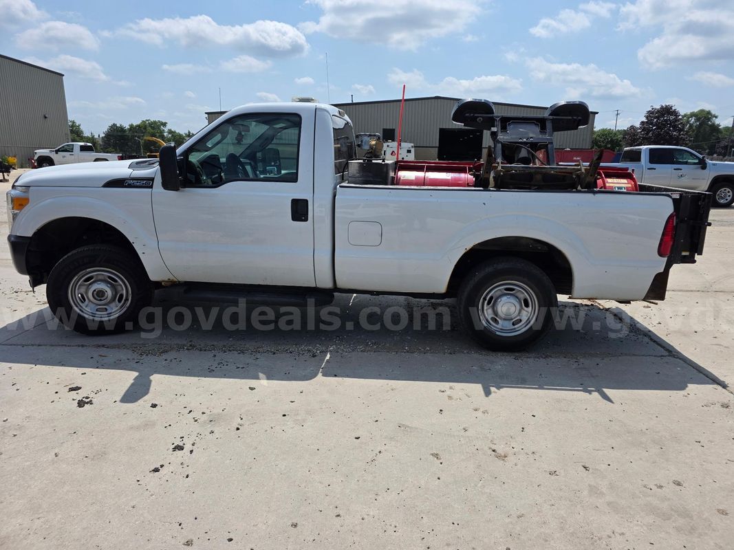 2013 Ford F-250 SD XL 4WD With Western plow and Tommy lift gate.