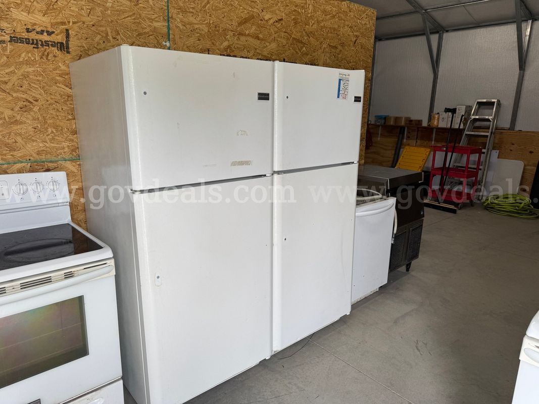 Five white refrigerators
