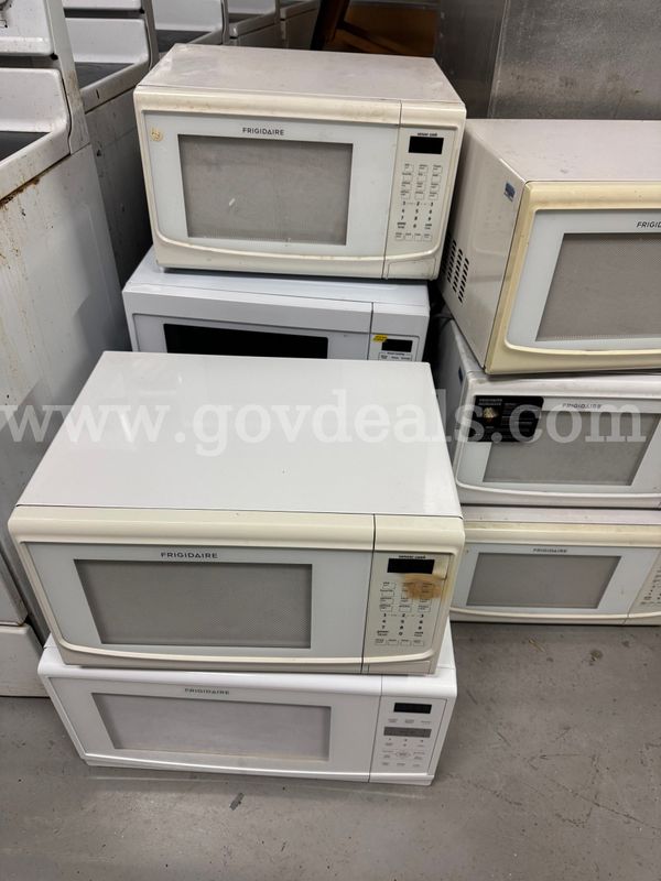 Used classroom microwaves, white in color