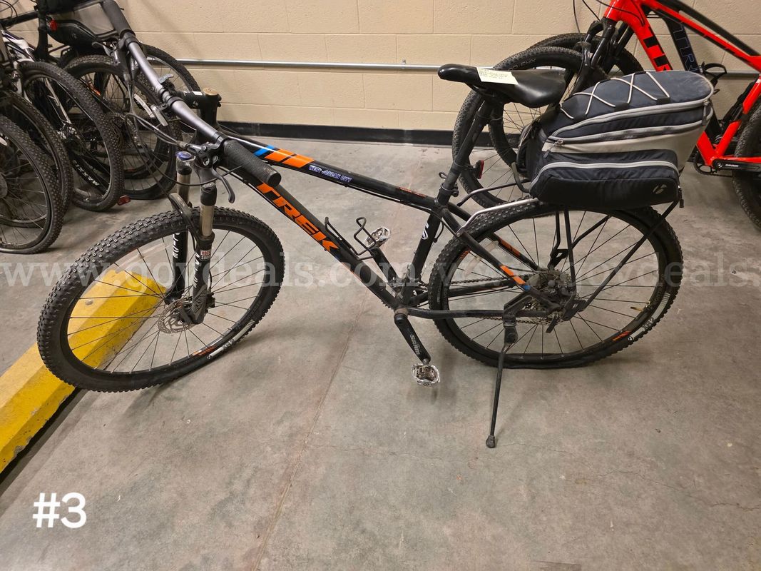 Used black Trek Xcaliber8 bike. Bike has flat tires.