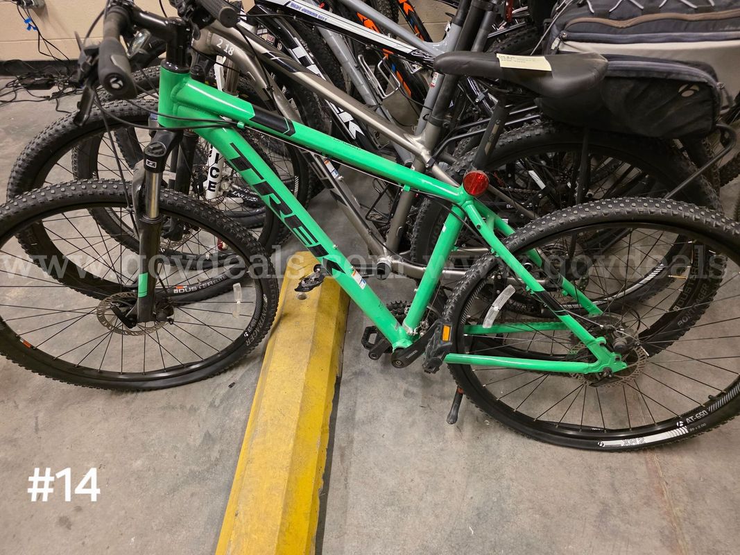 Used green Trek Marlin 5 bike. Bike tires are flat.