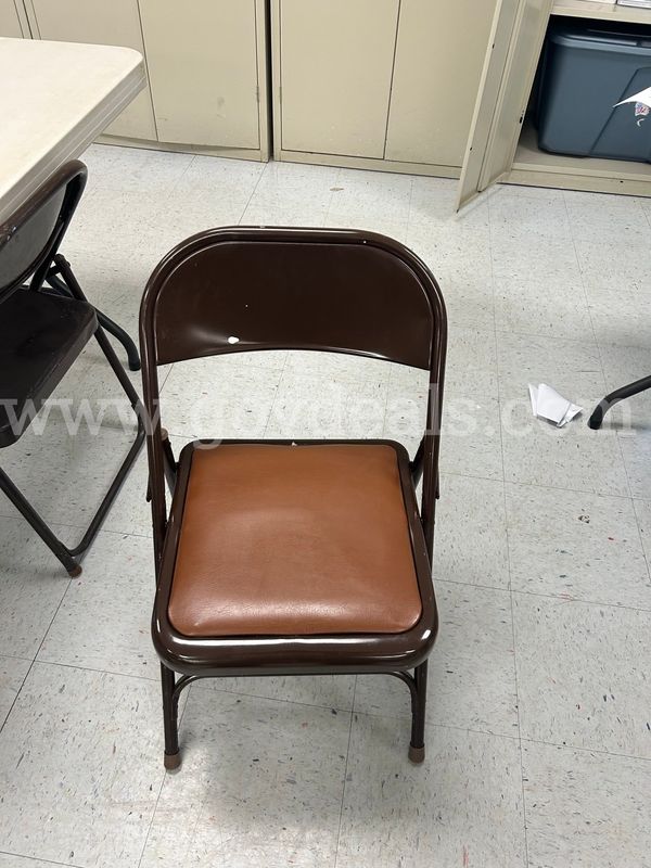 3 brown folding chairs. Sold as is no returns or refunds. Chairs show signs of wear and tear.