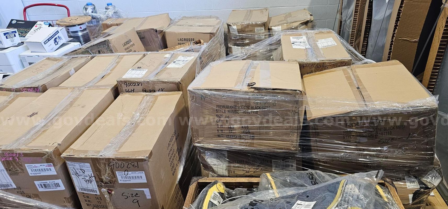 Pallets of knee boots and hip boots
