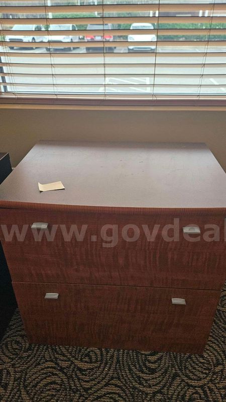 Wooden cabinet with polished handles