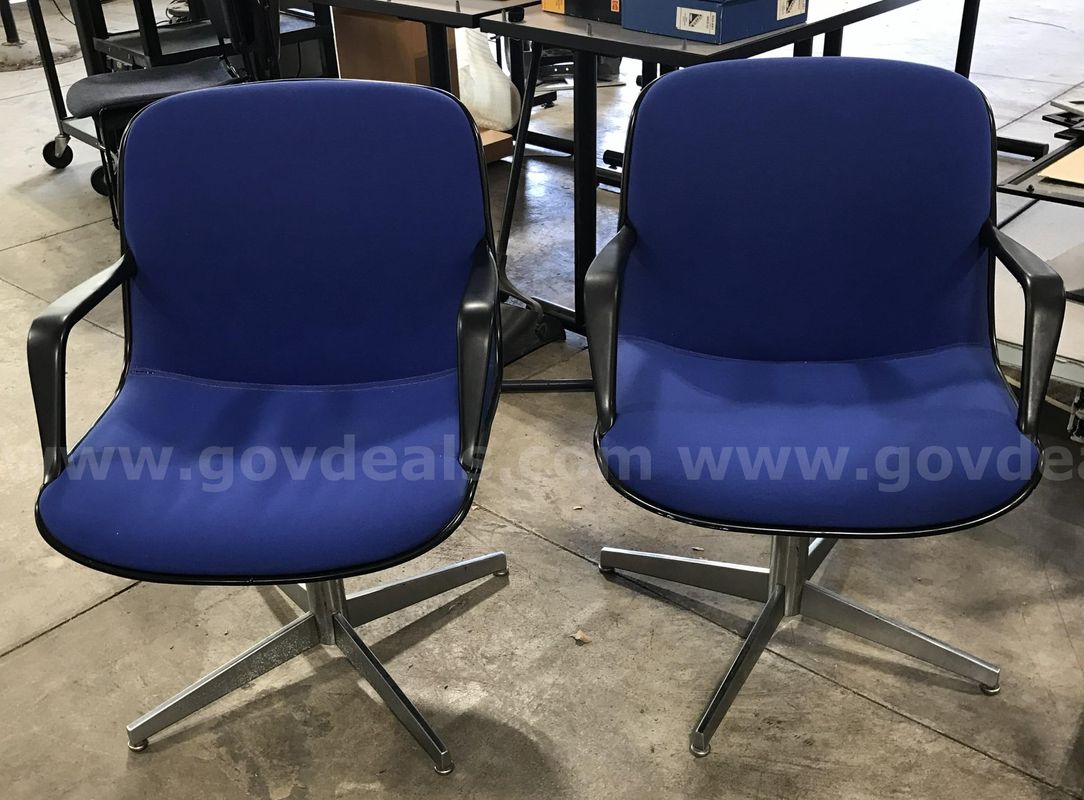 2 used blue swivel chairs. (S2)