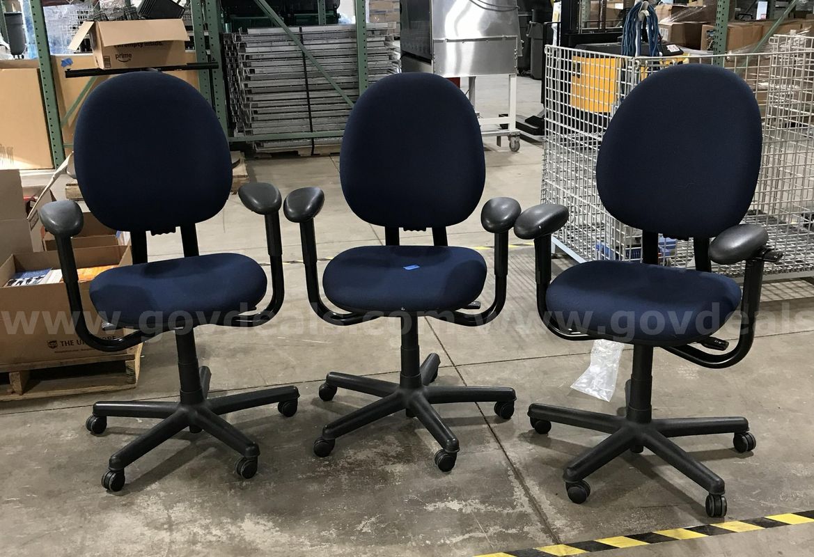 3 used blue office chairs.