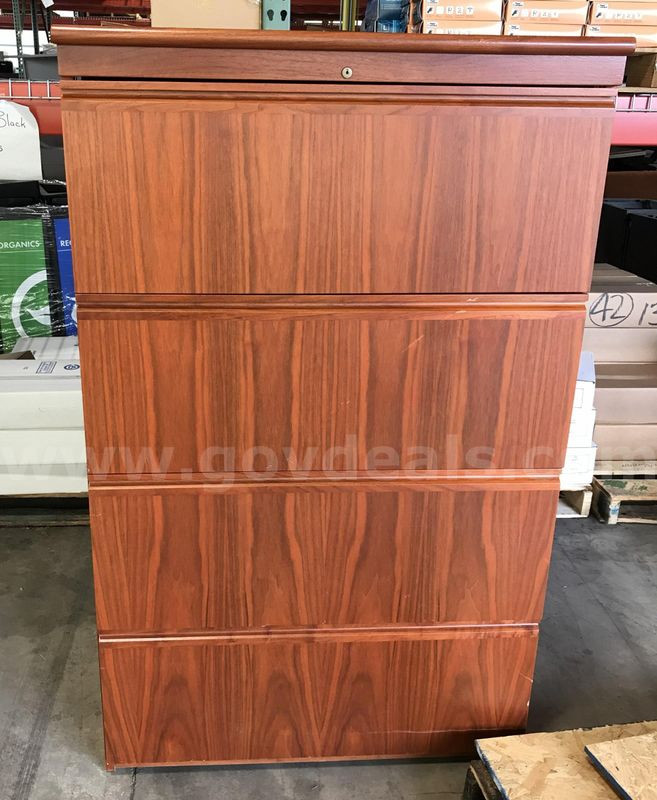 Used wood lateral 4 drawer file cabinet.