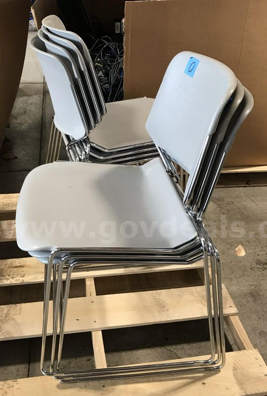 7 used stackable chairs. (S2)