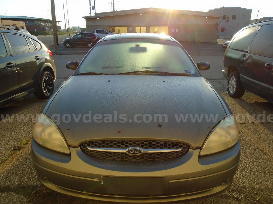 2002 Ford Taurus sedan (greenish gray color)