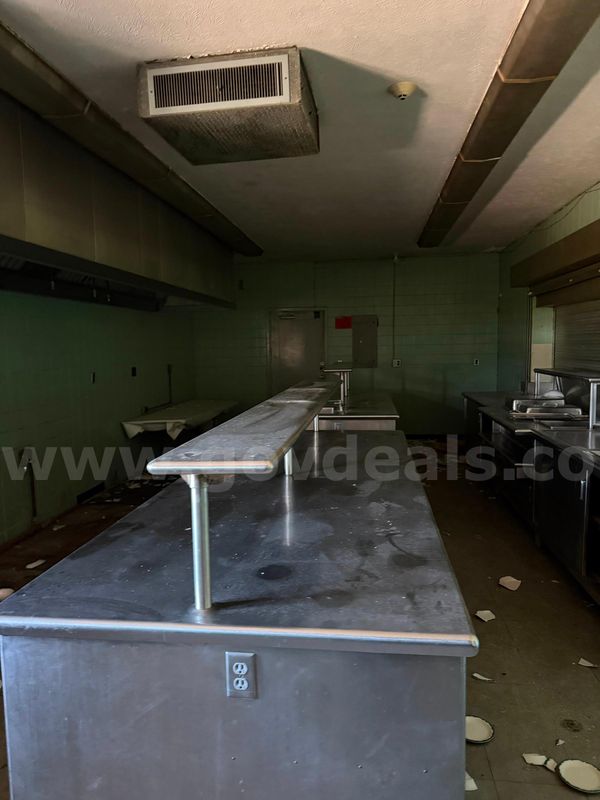 Lot of unknown amounts of stainless-steel, commercial-grade kitchen counter stations.