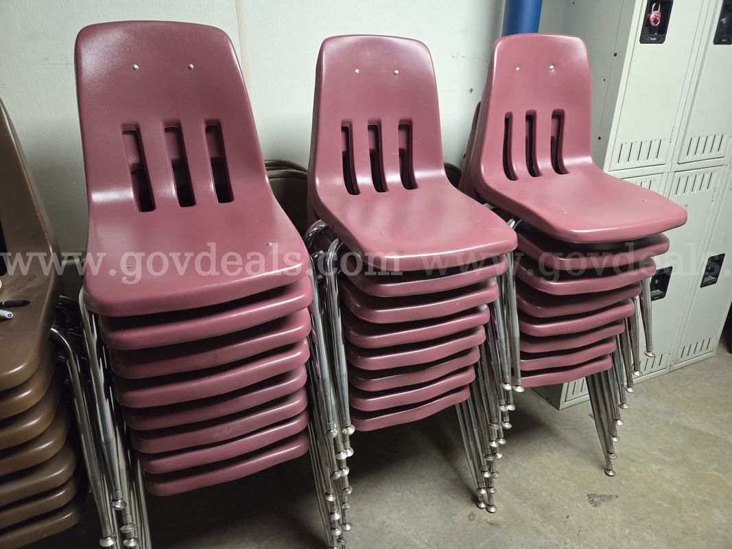 Lot of 24 stacking mauve plastic chairs