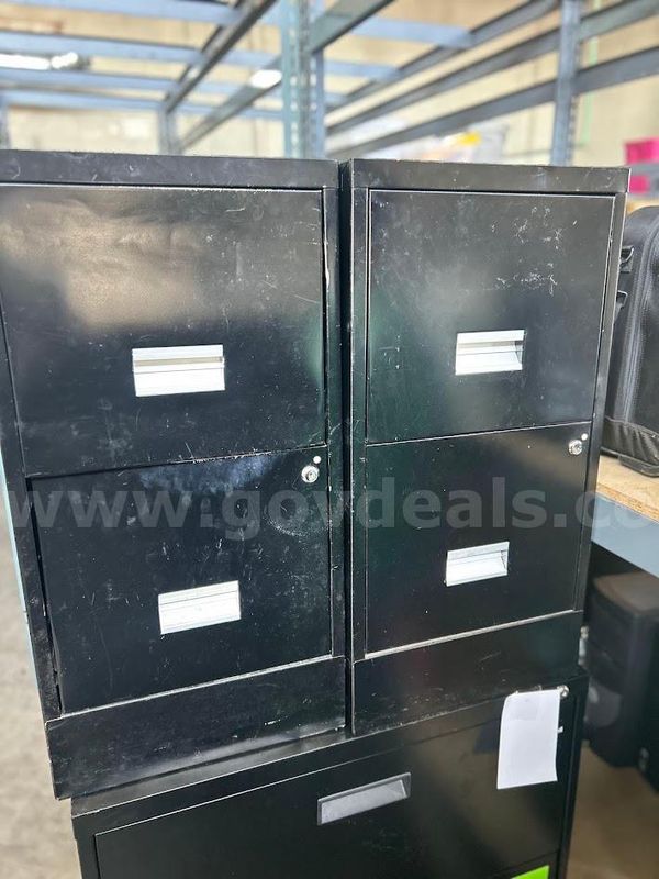 Two black two drawer file cabinets