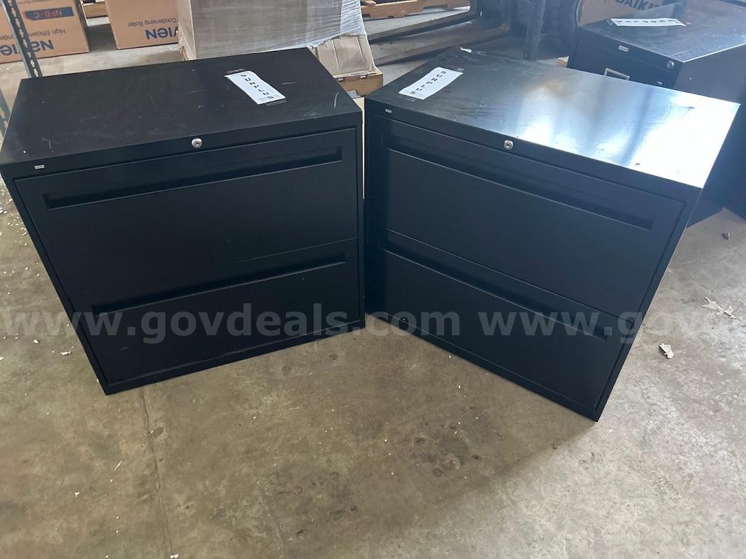 Two black lateral file cabinets