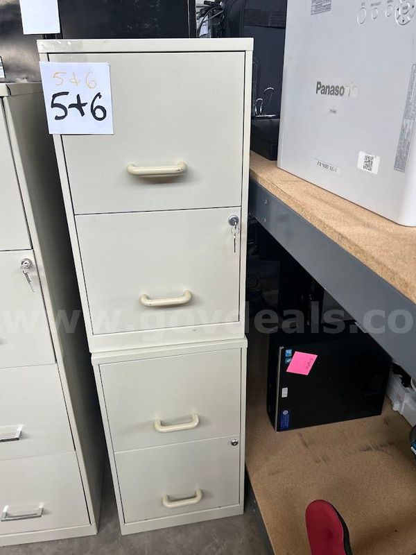 Two tan two drawer file cabinets