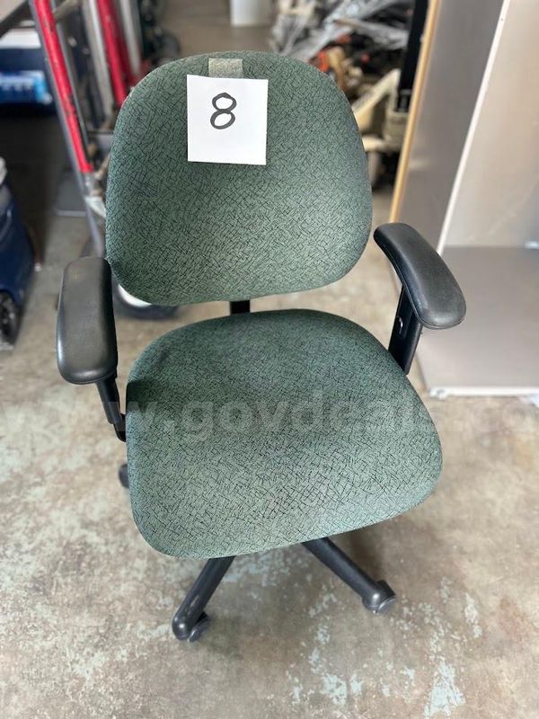 Green office chair on wheels